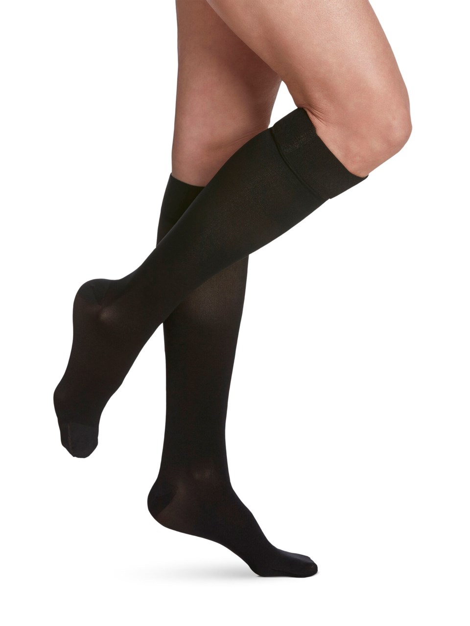 Female wearing ESSENTIAL: OPAQUE grip-top calf in BLACK