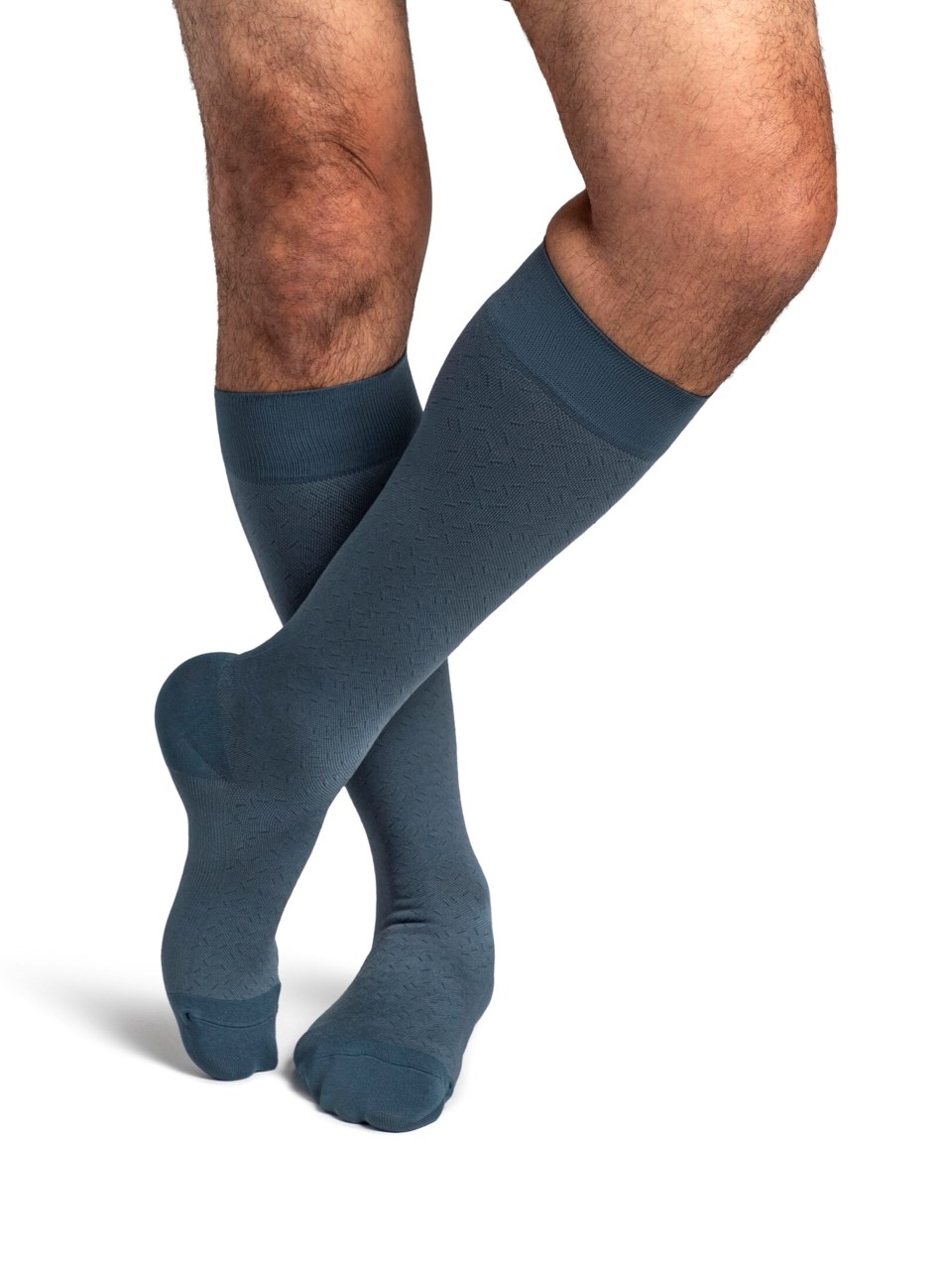 Man wearing Sigvaris Style Microfiber Patterns compression socks in the color Storm Blue Confetti