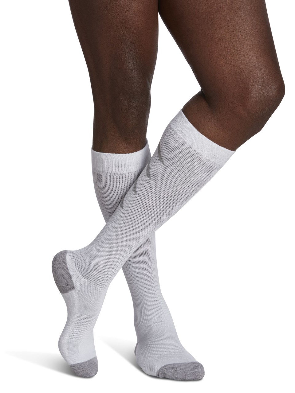 Male wearing WELLBEING ATHLETIC RECOVERY compression socks in WHITE